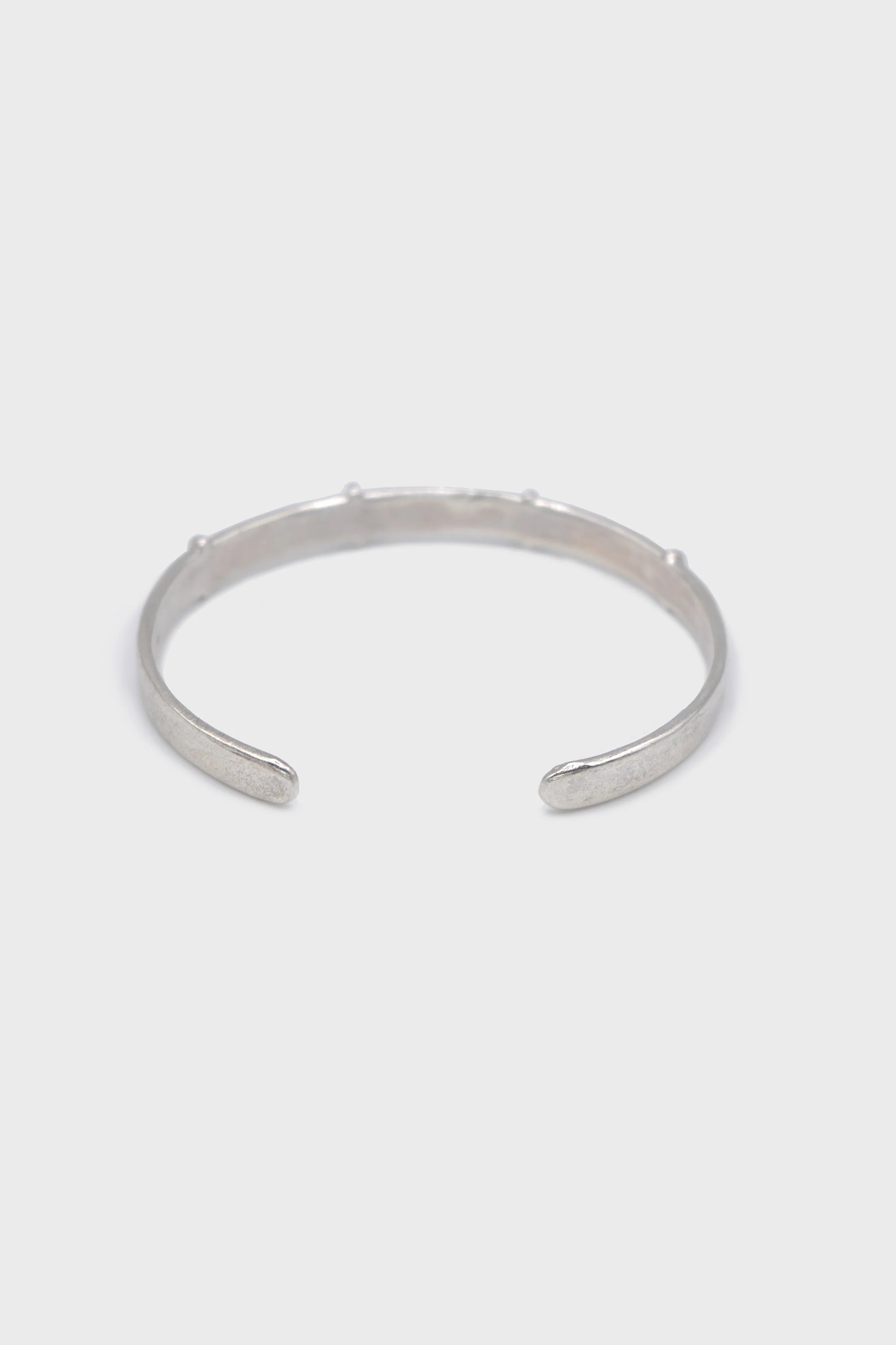 THIN SILVER STITCHED CROSS SILVER BANGLE - Image 3